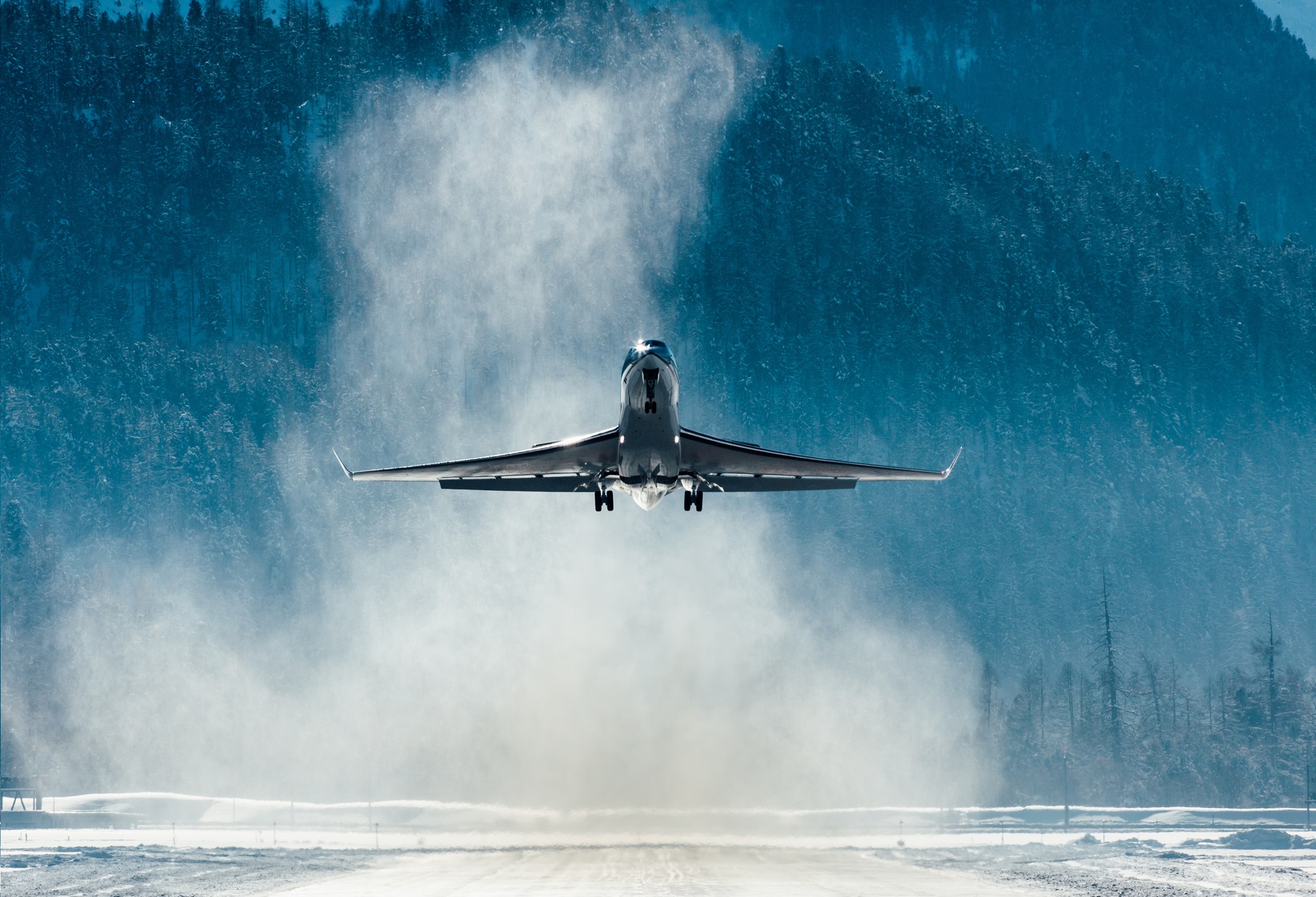 Private jet departing a winter runway