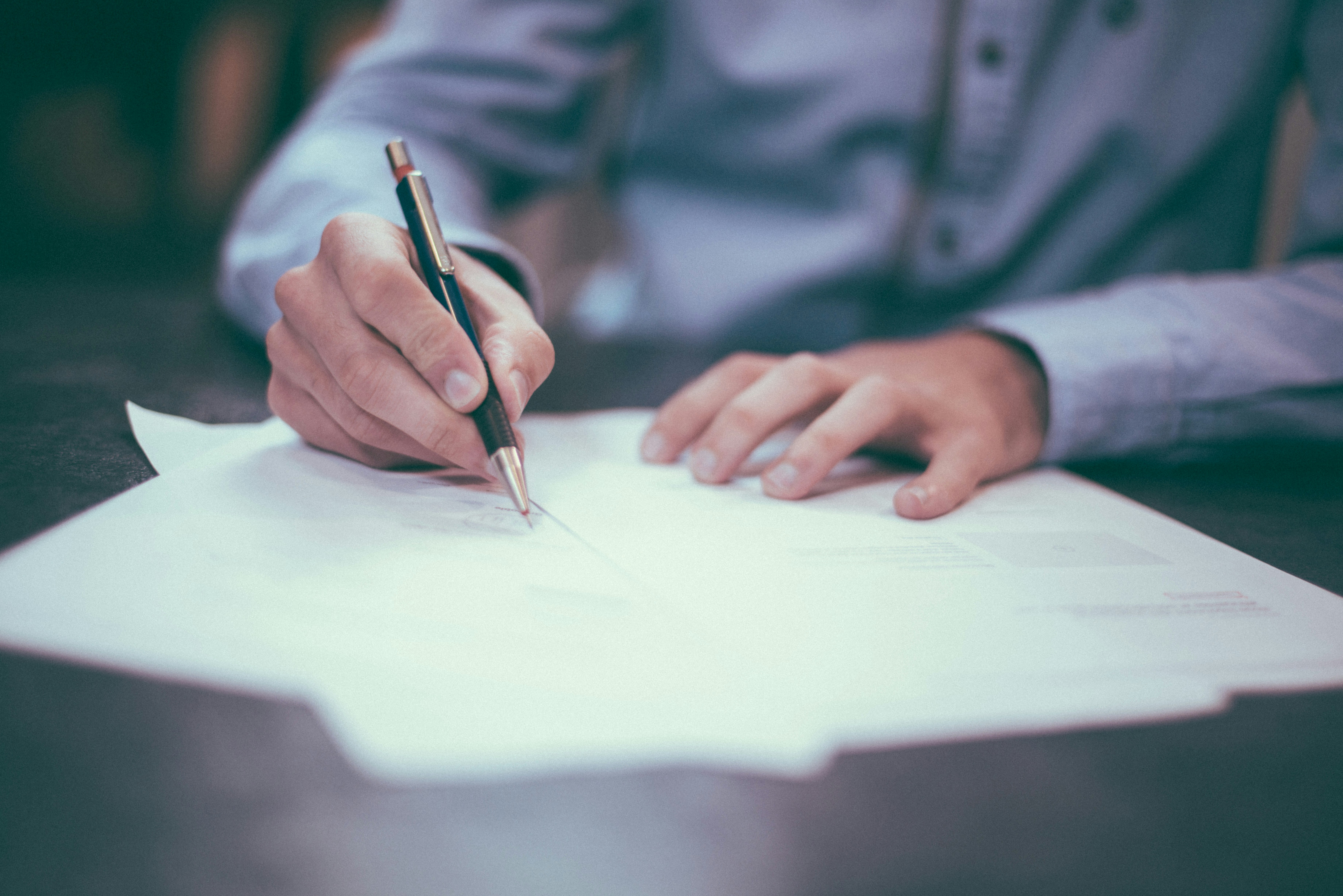 Signing aircraft sales paperwork